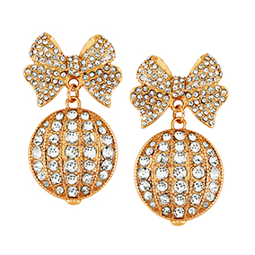 Korvakorut, kullanvärinen rusetti ja joulupallo